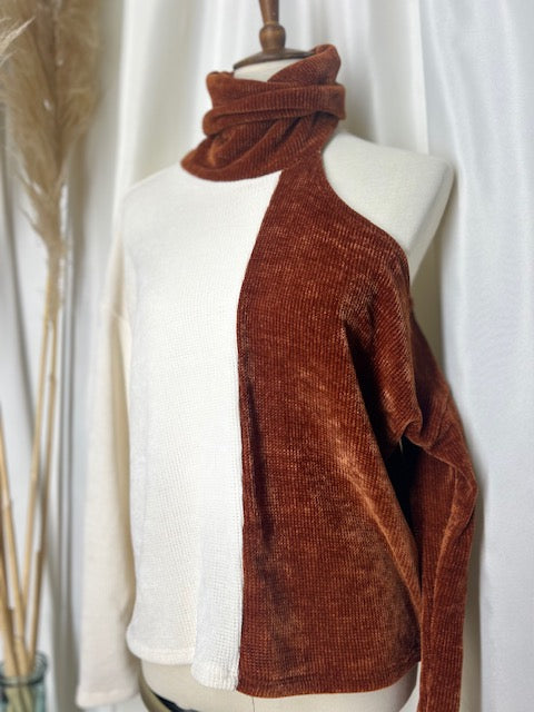 sideview of contrast colored off the shoulder sweater top