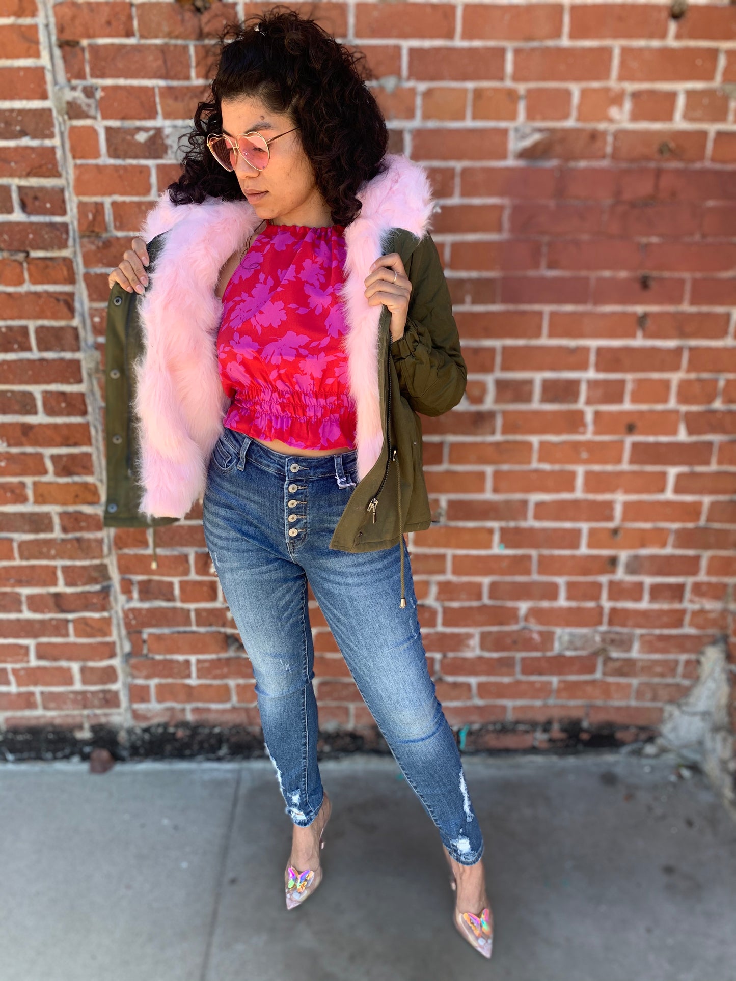 model showing off the pink lining of a cargo jacket