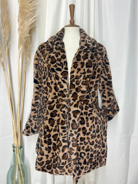 Classic leopard coat showcased on a mannequin with a gorgeous neutral backdrop