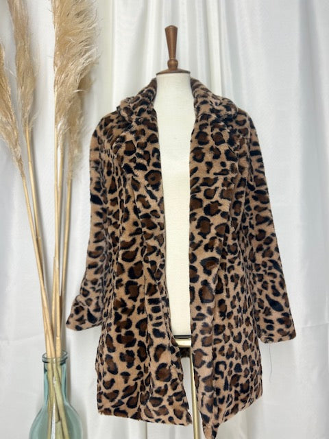 Classic leopard coat showcased on a mannequin with a gorgeous neutral backdrop