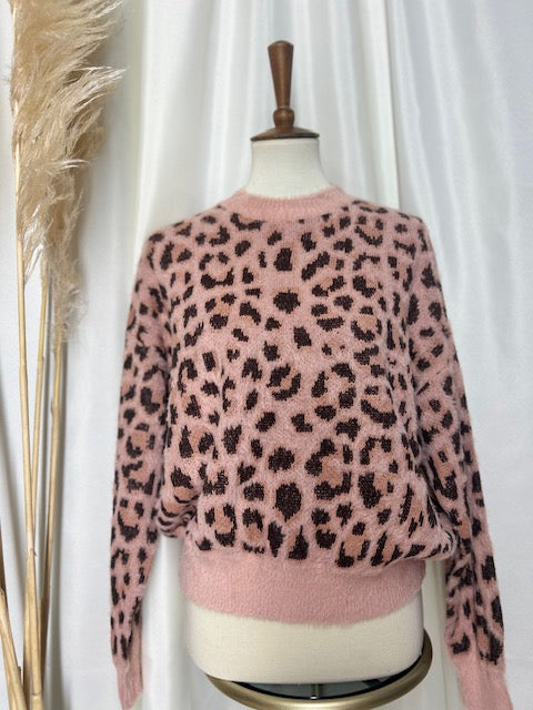 trendy stylish pink and brown leopard print sweater displayed on mannequin with pampas boho back drop