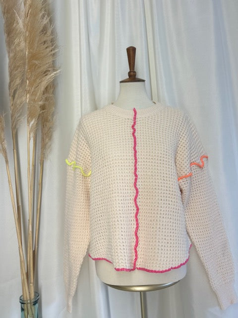 cute knit layering sweater showcased on torso with pampas in vase